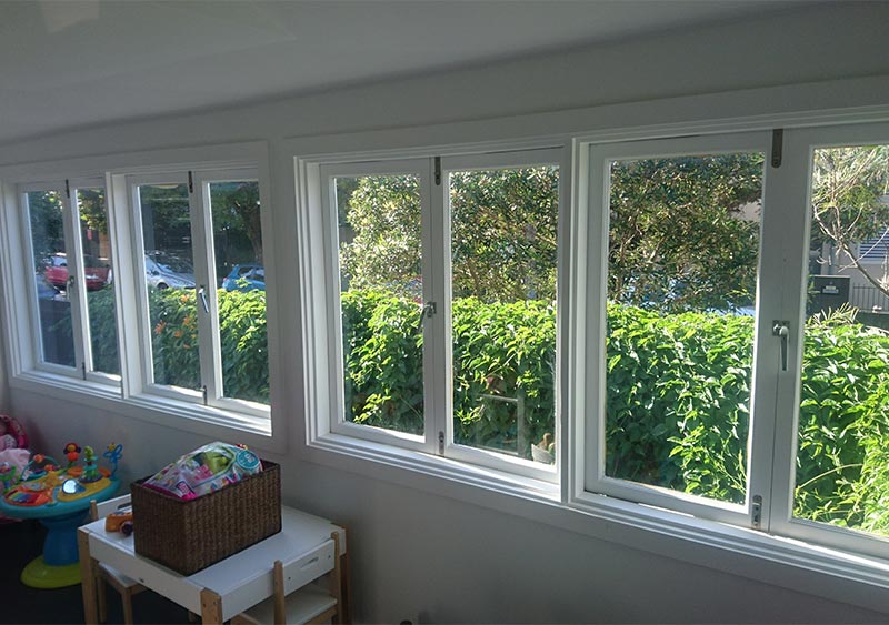 an inside view of the white house with opened plantation shutters